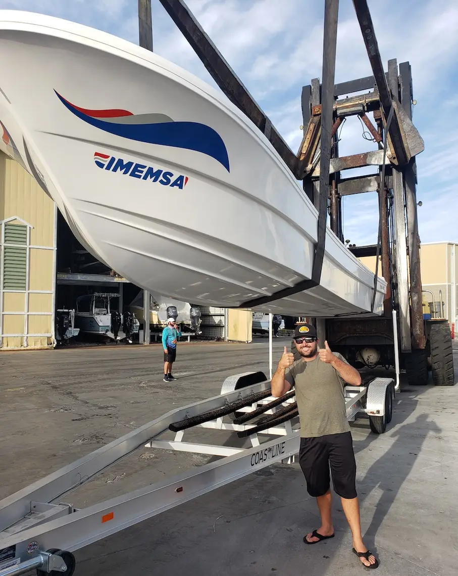 Panga Boats USA — Hull coming off the lift · Happy Owners